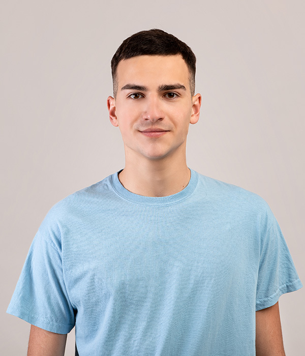 portrait-of-positive-young-guy-in-t-shirt-looking--GKPQ7BL