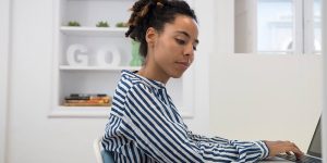 businesswoman-typing-on-laptop-at-office-desk-2023-11-27-04-59-02-utc